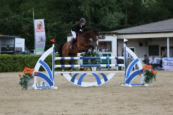 Nikki Ward jumping at a summer show