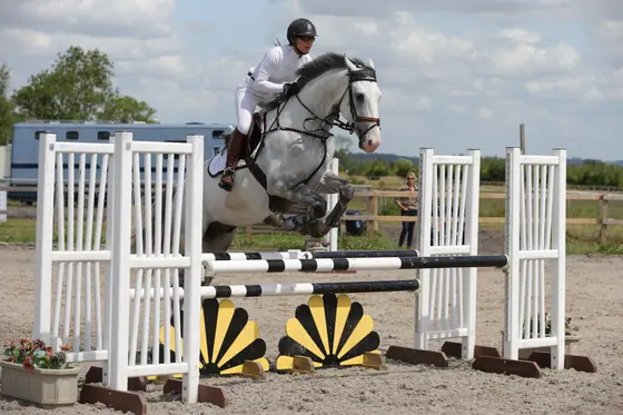 Nikki Ward jumping at a summer show