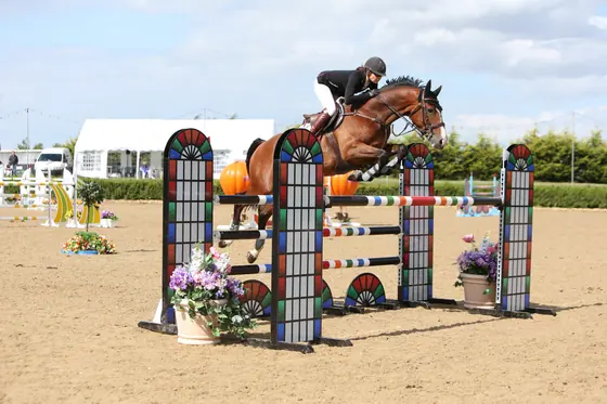 Nikki Ward jumping at a summer show