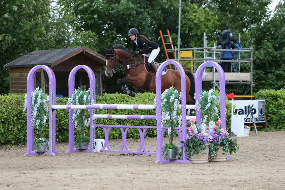 Nikki Ward jumping at a summer show